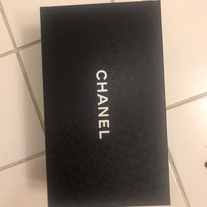 One empty Chanel shoe box with dustbag.